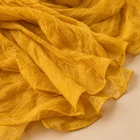 Crinkle Chiffon Wrap · Marigold, close-up of the detail