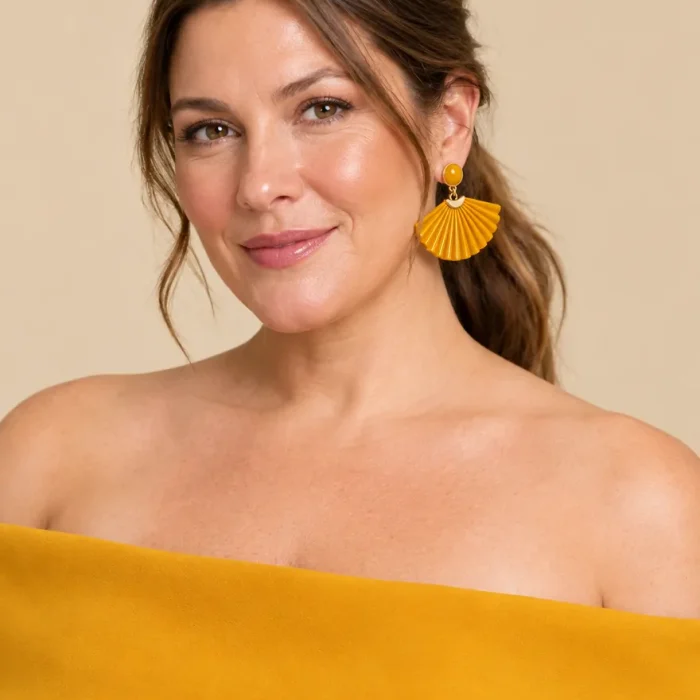 Sunray Fan Earrings · Marigold, worn with a matching dress (dress sold separately)