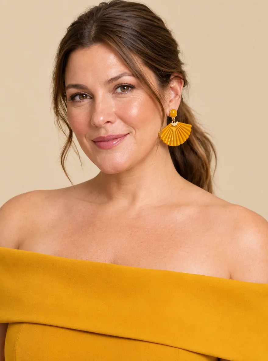 Sunray Fan Earrings · Marigold, worn with a matching dress (dress sold separately)